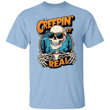 YVDragon Shop-Light blue Halloween graphic T-shirt featuring a cool skeleton wearing sunglasses with desert cactus background and bold text “Creepin’ It Real” – funny spooky skull shirt for Halloween party and casual wear.